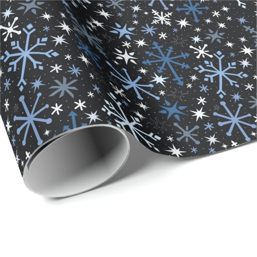 Een griezelige mest van blauwe sneeuwvlokken op zw cadeaupapier (Rol Hoek)