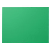 een groene achtergrond en witte rand notitieblok (Voorkant)
