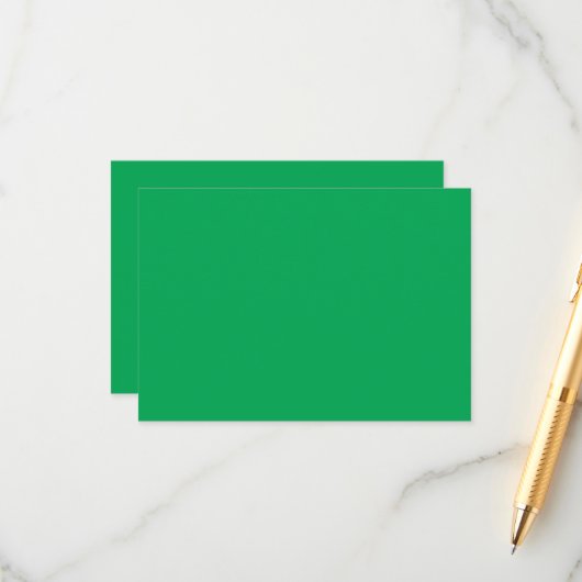 een groene achtergrond met een informatiekaartje (Voorkant / Achterkant in situ)