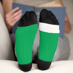 Een groene achtergrond met een sokken