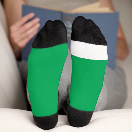 Een groene achtergrond met een sokken (Onderkant)