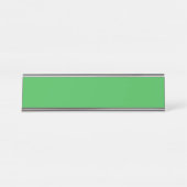 Een groene achtergrond met een witte rand bureau naambordje (Voorkant)