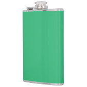 Een groene achtergrond met een witte rand heupfles (Links)
