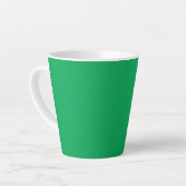 Een groene achtergrond met een witte rand latte mok (Linkerhoek)