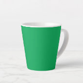 Een groene achtergrond met een witte rand latte mok (Rechterhoek)