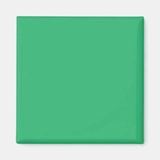 Een groene achtergrond met een witte rand magneet (Voorkant)