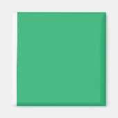 Een groene achtergrond met een witte rand magneet (Voorkant)