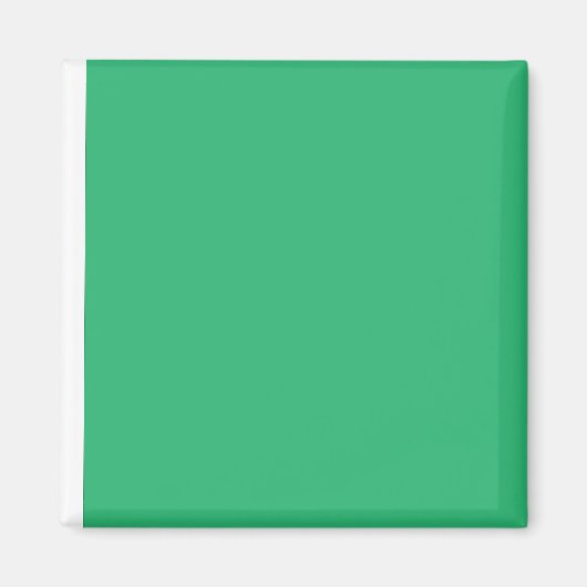 Een groene achtergrond met een witte rand magneet (Voorkant)