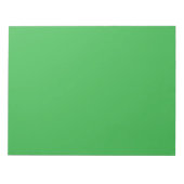Een groene achtergrond met een witte rand notitieblok (Voorkant)