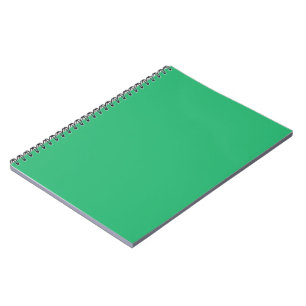 Een groene achtergrond met een witte rand notitieboek