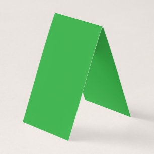 Een groene achtergrond met een witte rand visitekaartje
