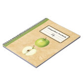 Een groene appel en een half gepersonaliseerde com notitieboek (Linkerzijde)