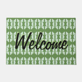 Een groene deurmat met een dessin (Voorkant)