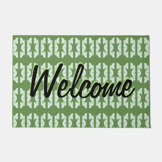 Een groene deurmat met een  dessin (Voorkant)