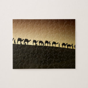 Een groep kameelherders met hun kamelen legpuzzel