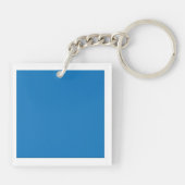 Een heldere blauwe lucht zonder wolken vult de hel sleutelhanger (Achterkant)