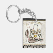 Een hoefijzer, een tas en een paar bril sleutelhanger (Voorkant Links)