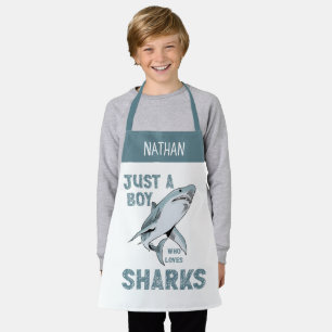Een jongen die dol is op haaienliefhebbers schort
