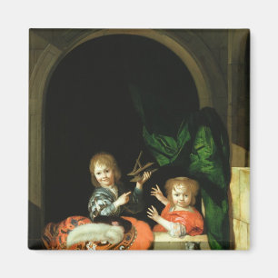 Een kat die naar twee jongens kijkt magneet