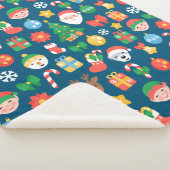 Een keurig kerstpatroon op blauw sherpa deken (3/4)