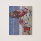 Een klein meisje dat zand speelt legpuzzel (Verticaal)