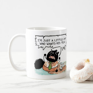 Een kleine kat die zijn thee wil. koffiemok