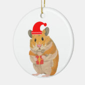 Een kleine kersthamster met een cadeau keramisch ornament (Links)