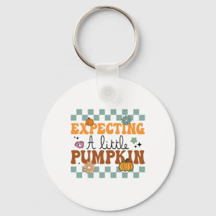 Een kleine pompoen-halloween zwangerschap verwacht sleutelhanger