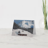 Een knappe wintervakantie, sneeuwbergen en bos feestdagen kaart (Voorkant)