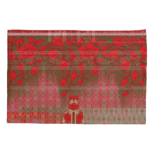 Een kruissteek patroon met rode bloemen en wijnsto kussensloop