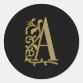 Een krullend monogram op zwart ronde sticker (Voorkant)