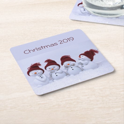Een kwartet sneeuwpoppen kartonnen onderzetters (Schuin)