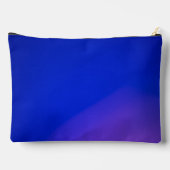 Een levendig blauwe ritssluitingstas met een subti etui (Achterkant)