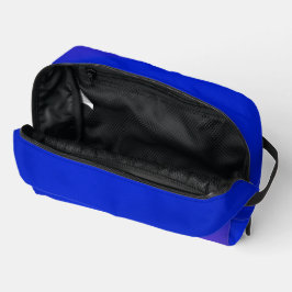 Een levendig blauwe ritssluitingstas met een subti toilettasje