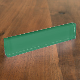 Een levendig groen blad met duidelijke nerven is v naambordje