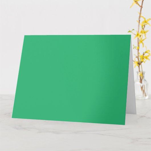 Een levendig groen blad met prominente aderen en e kaart (Gele Bloem)