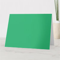Een levendig groen blad met prominente aderen en e