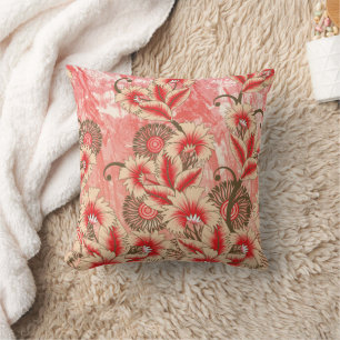 Een levendig rood en perzik textielontwerp met f kussen