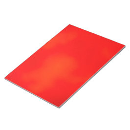 Een levendig rood notitieboek met een subtiele notitieblok
