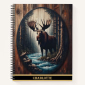 Een majestueuze eland die bij een serene rivieroev notitieboek (Voorkant)