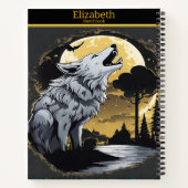 Een majestueuze wolf huilt bij het gloeiende maanl notitieboek (Achterkant)