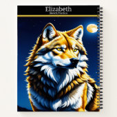 Een majestueuze wolf huilt bij het gloeiende maanl notitieboek (Achterkant)