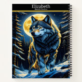 Een majestueuze wolf huilt onder een heldere maanv notitieboek (Achterkant)