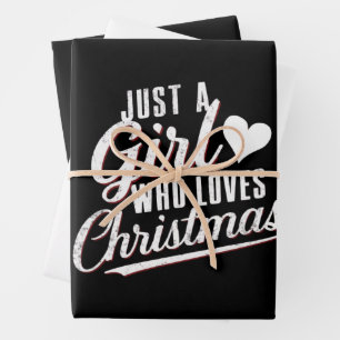 Een meisje dat van kerst houdt inpakpapier vel