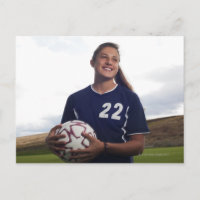 een meisje voetballer met voetbal
