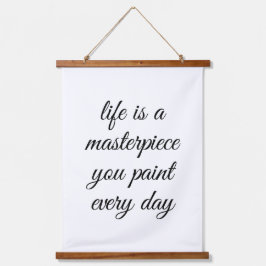 Een muurschildertje met bovenzijde hangend wandkleed