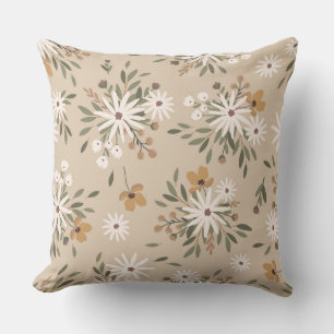 Een neutrale beige kleur met witte en perzikbloeme kussen