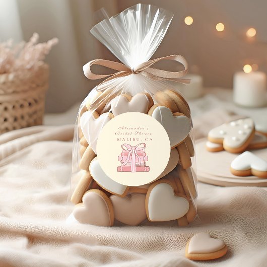 Een nieuw hoofdstuk begint met roze boeken en boog ronde sticker