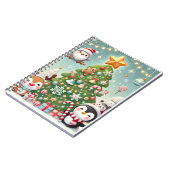 een notitieboek met een kerstboom en een leuk kara (Linkerzijde)