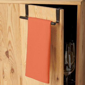 Een oranje achtergrond met een theedoek
